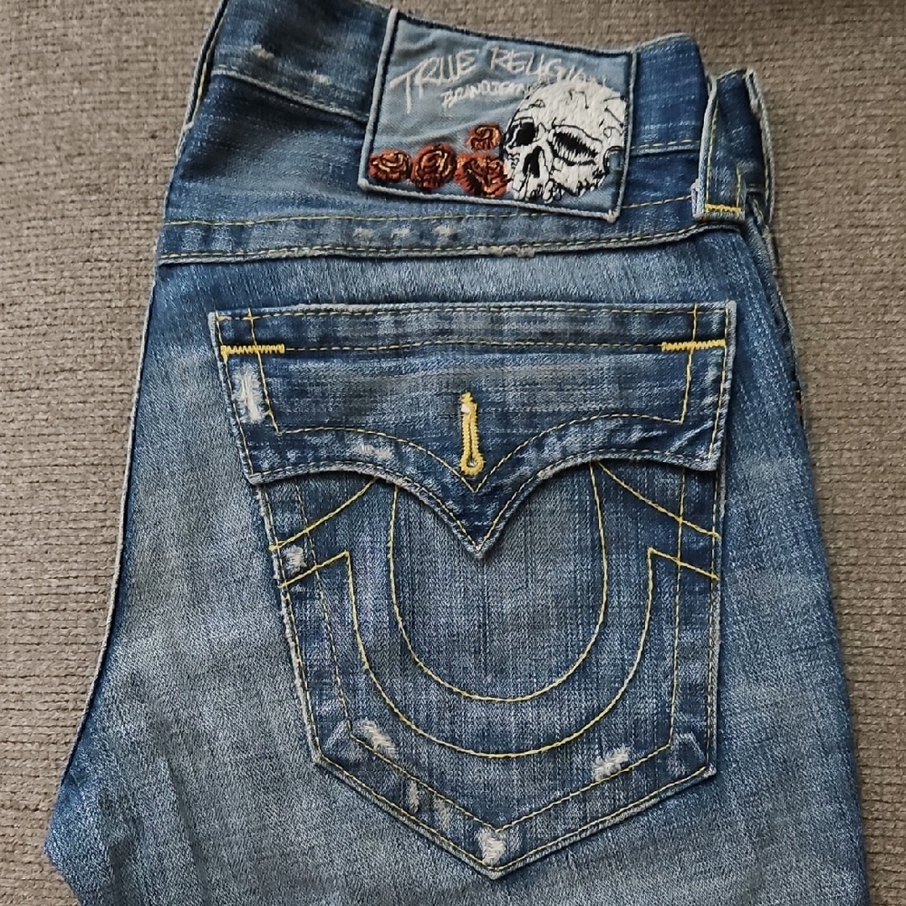 True Religion Distressed Blue Jeans with Skull Patch